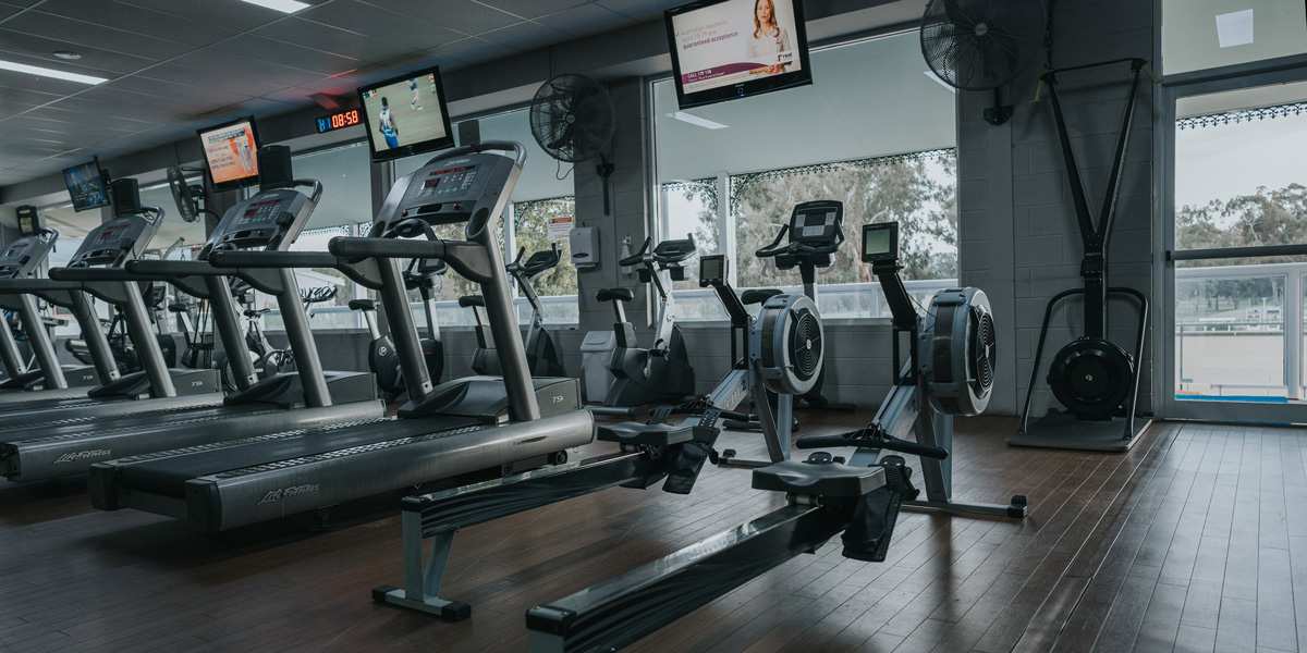 Rowing machines and treadmill overlooking Mulwala Golf Club Resort 24/7 Gym